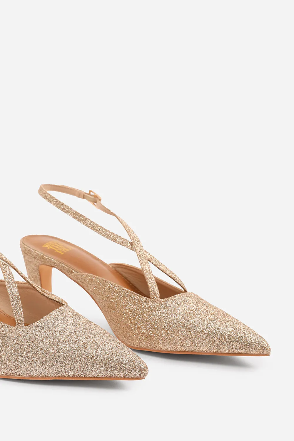 AUSTEN WIDE FIT POINTED TOE LOW BLOCK HEEL WITH CROSS OVER ANKLE STRAP IN GOLD FINE GLITTER